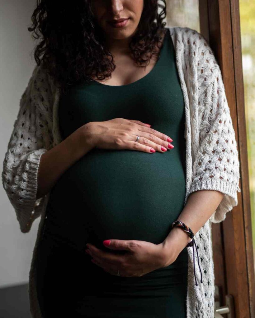 Pregnant lady caressing her belly