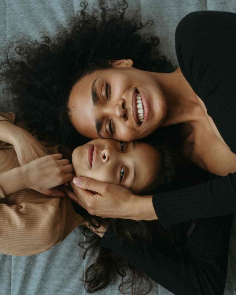 Mother caressing daughters face